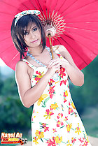 Holding parasol wearing dress